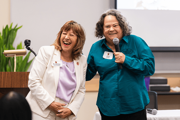 Dr. Barbara Dunsheath laughs with Betty Porto