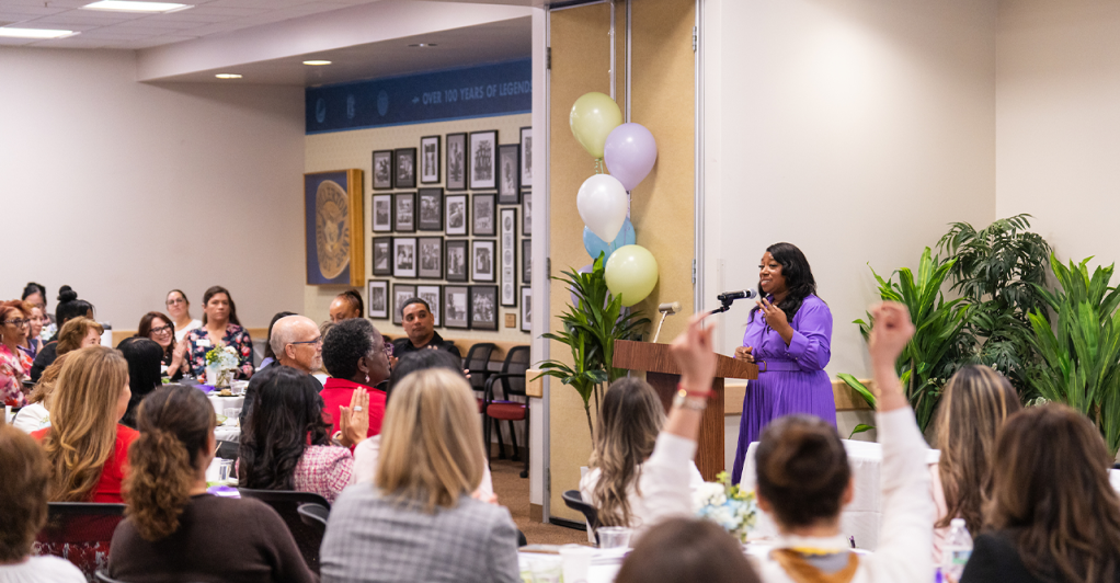 Dr. Letitia Clark presents to a room of attendees